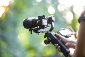 Professional videographer shoots broll with gimbal